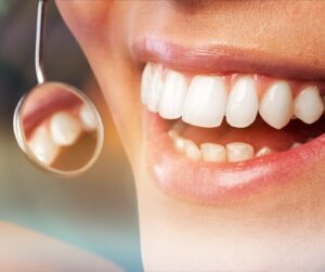 Clapton dentist providing gum disease treatment to a patient with bleeding gums.